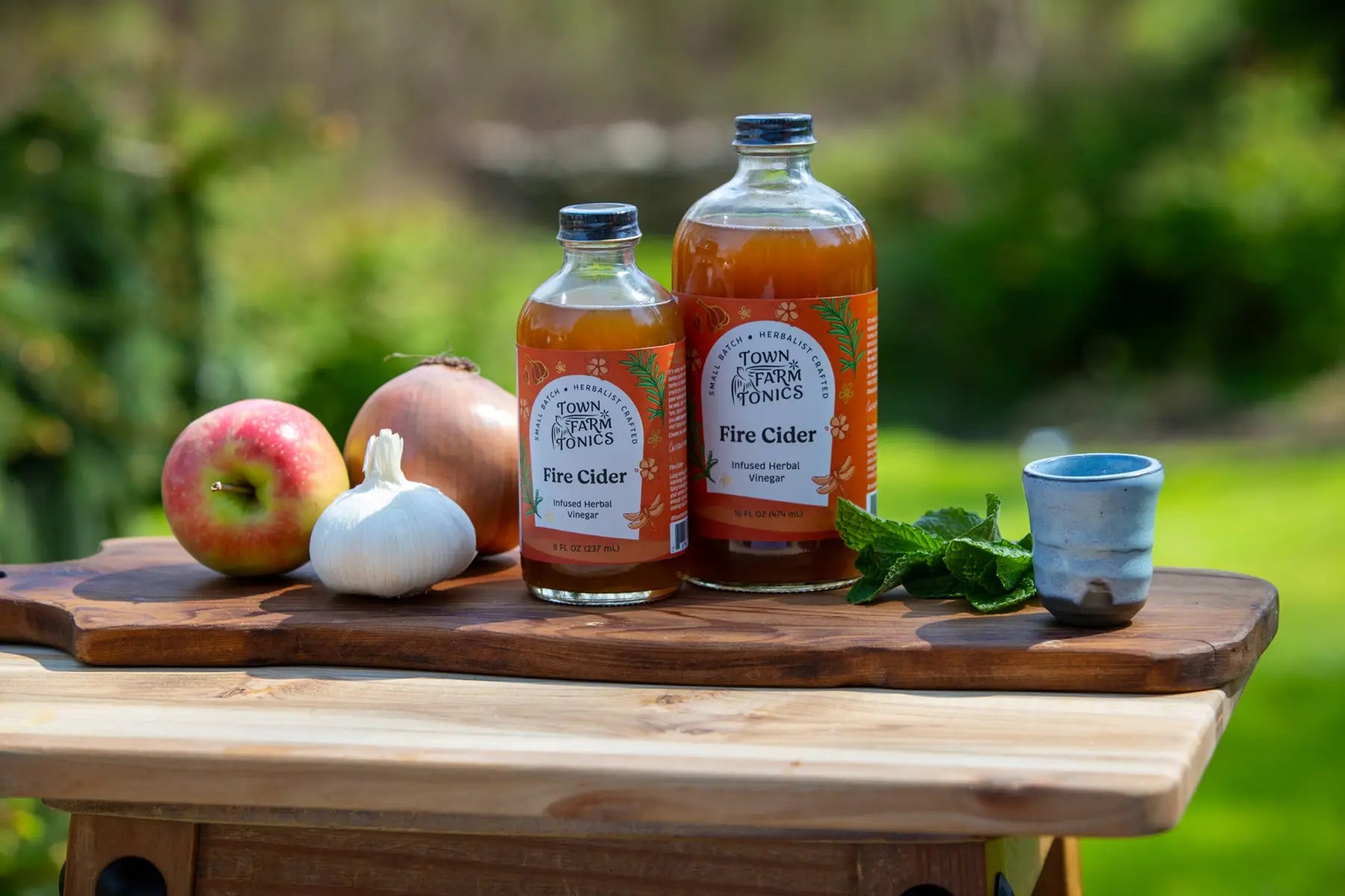 Fire Cider Tonic bottled product on cutting board