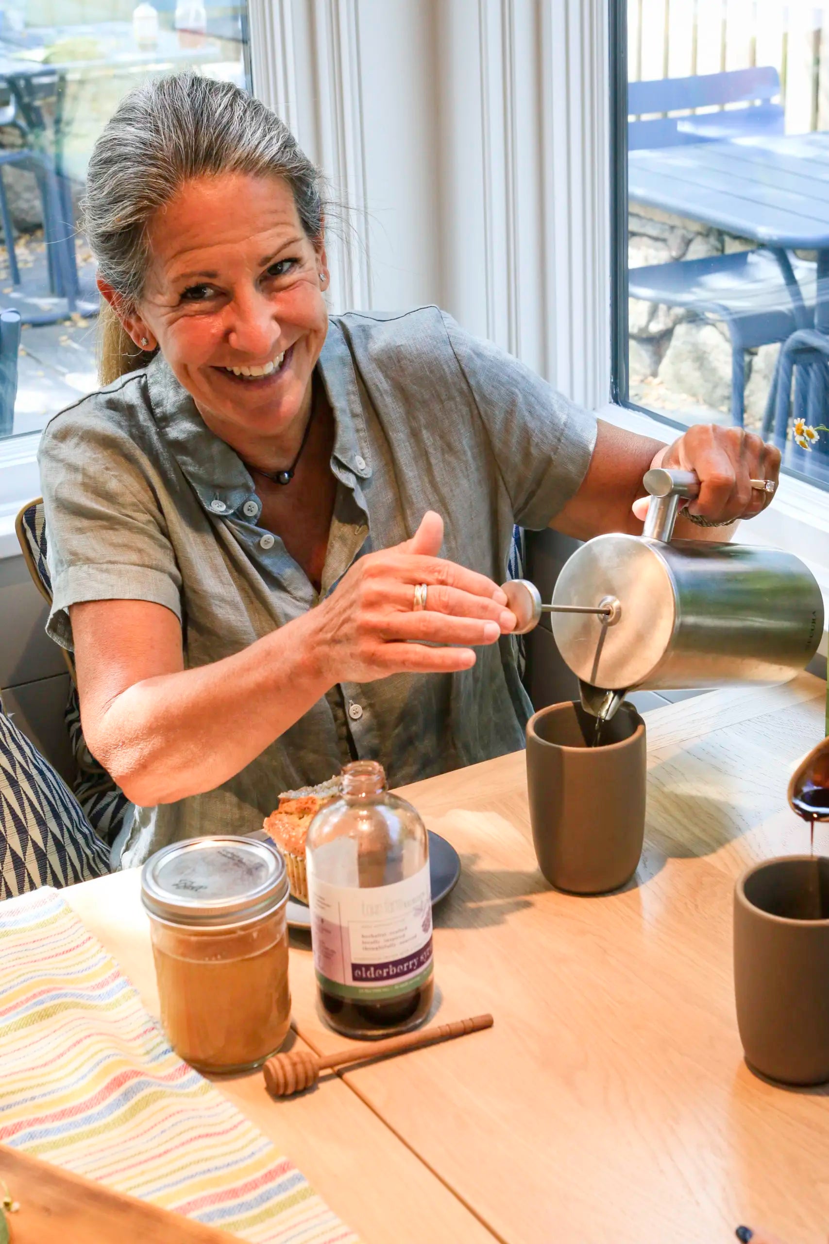 Woman pouring recover product into cup