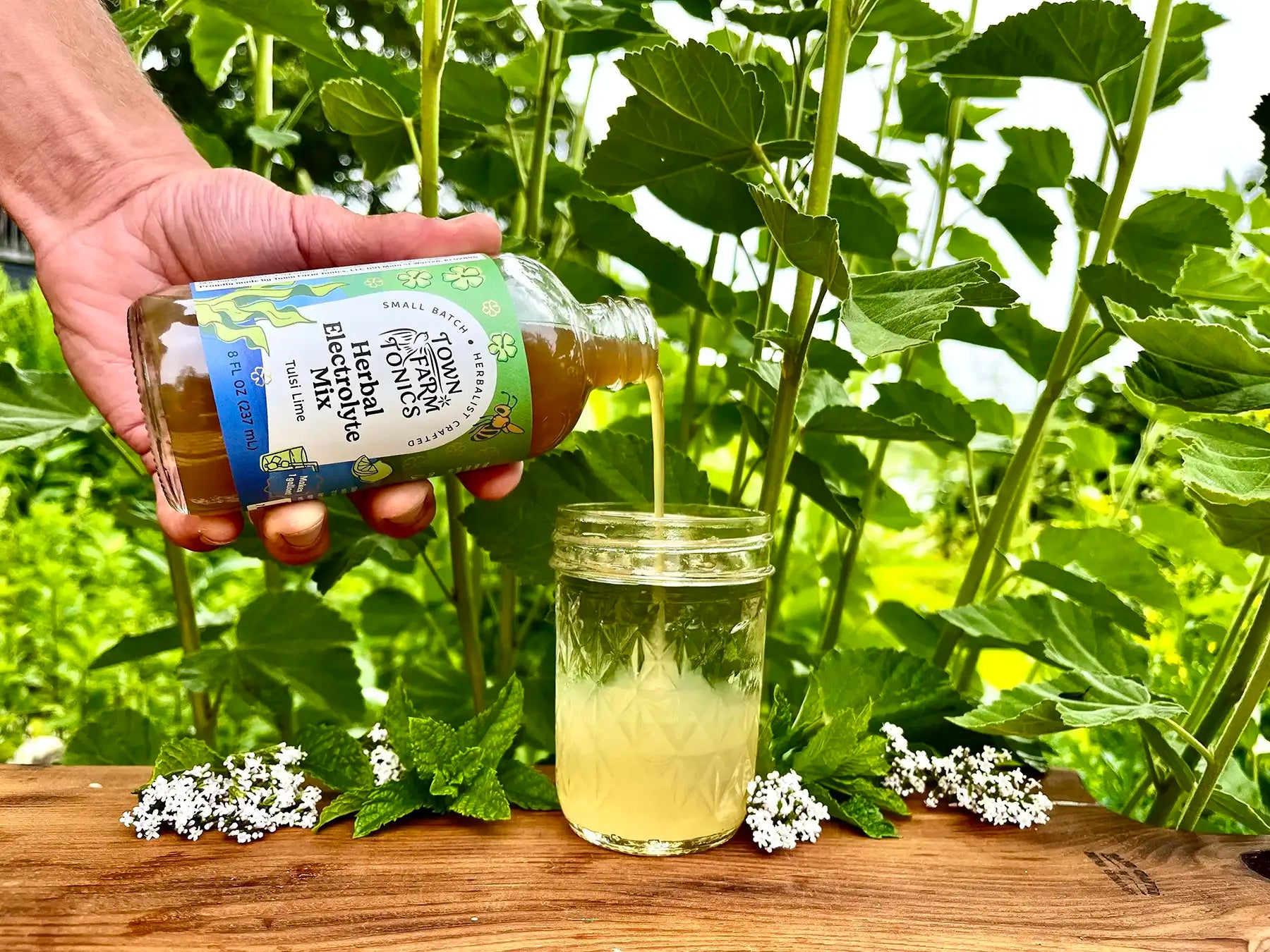Pouring tonic recipe into jar