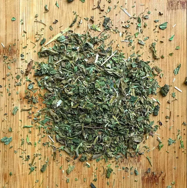 "Nourish" loose leaf tea blend made of nettles, tulsi (holy basil), lemon balm, red clover, oatstraw, and alfalfa